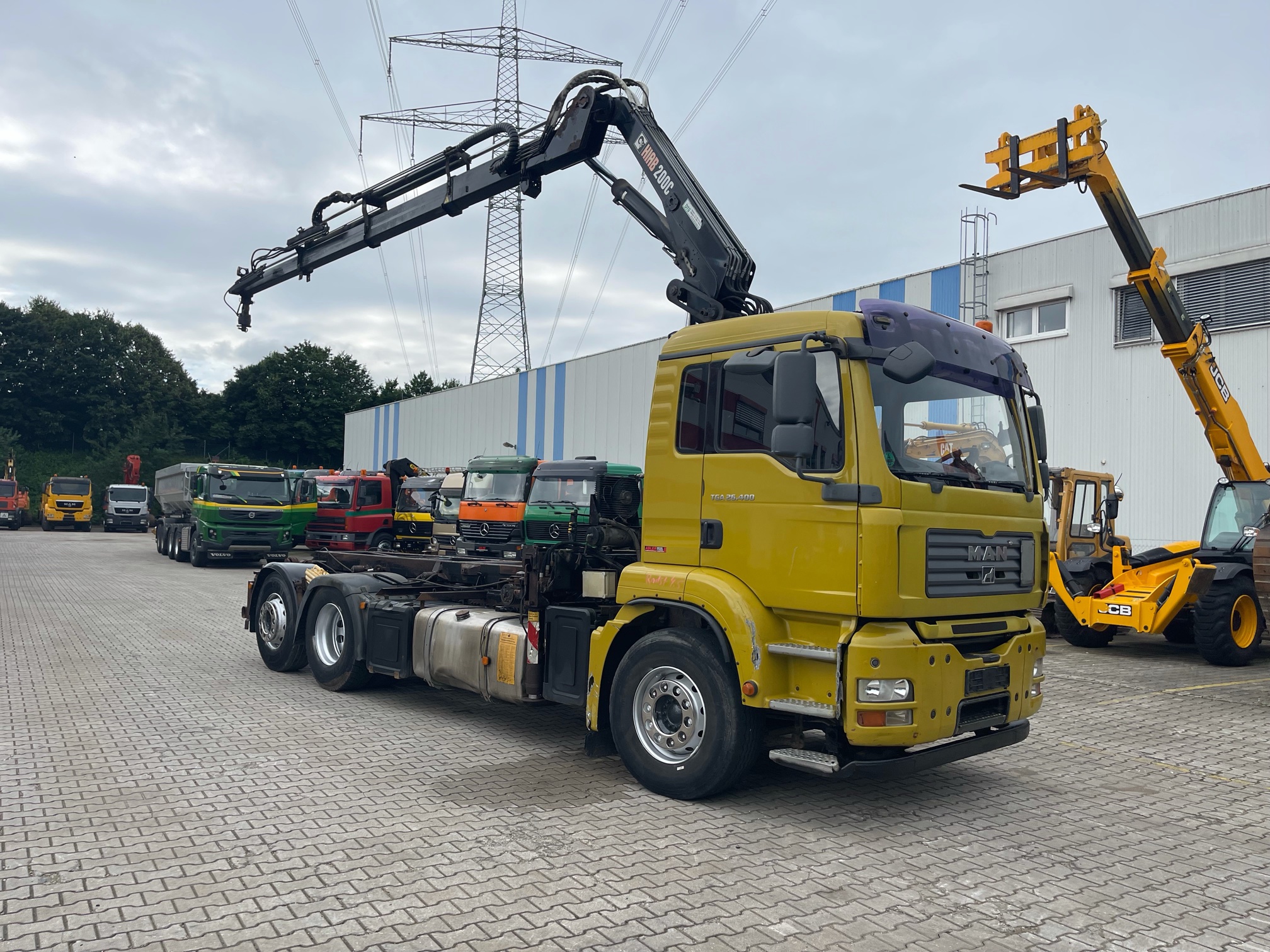 Abler Baumaschinen Angebot MAN TGA 26.400 Seilabrollkipper mit Kran